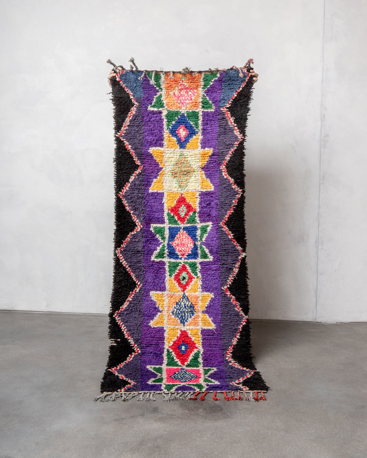 Modern designer vintage handcrafted Berber rug from Morocco. Boucherouite with beautiful colors and patterns.